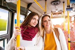 depositphotos 120983462 stock photo young women traveling by bus